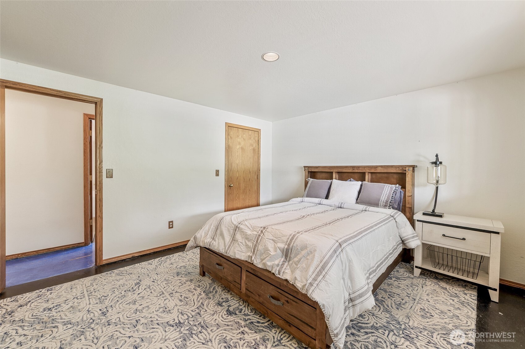 9656 North Road Peshastin, WA 98847 - Photo 28 of 40 a bedroom with a bed and wooden floor