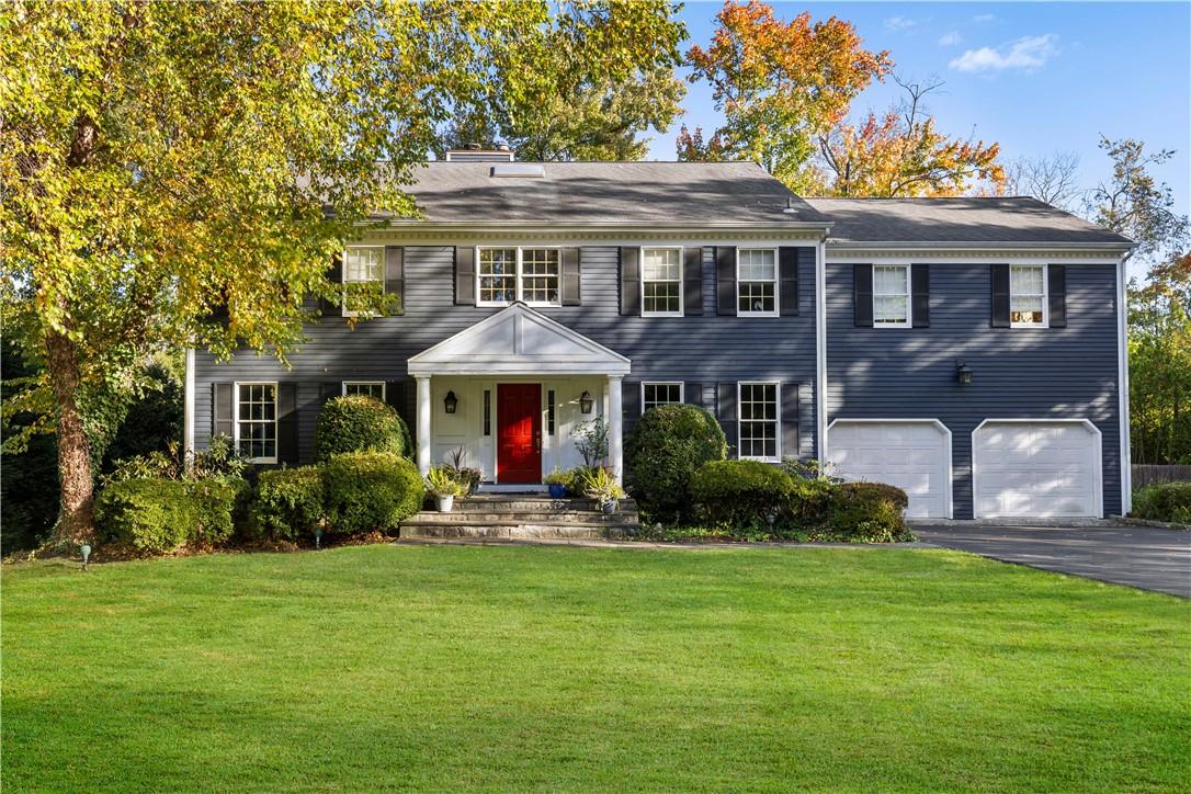 10 Packard Court Rye, NY 10580 - Photo 1 of 1 a front view of a house with a yard
