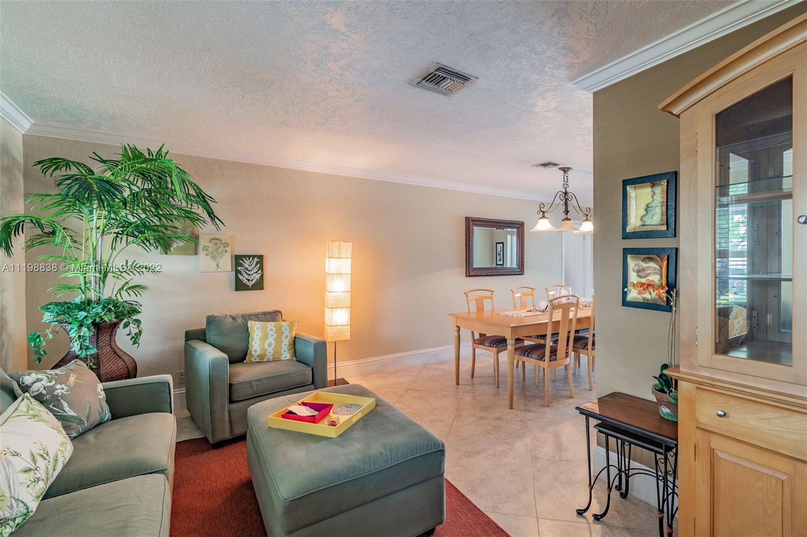 3015 Dunlin Road Delray Beach, FL 33444 - Photo 11 of 47 a living room with furniture and wooden floor