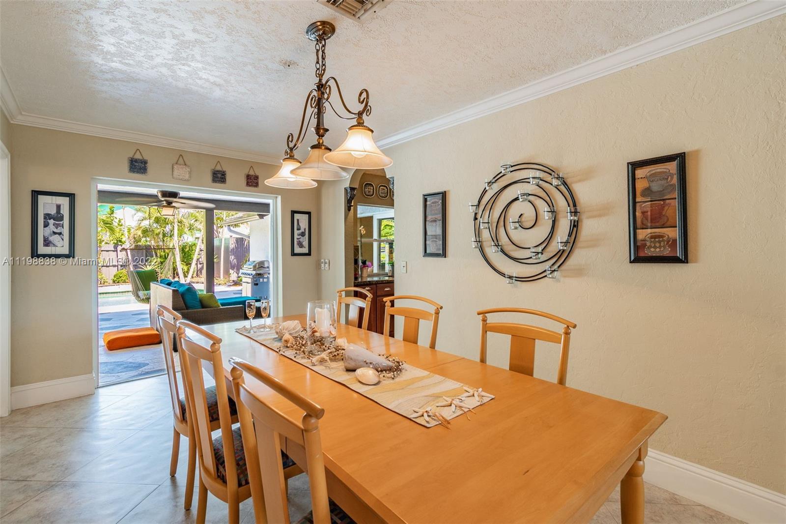 3015 Dunlin Road Delray Beach, FL 33444 - Photo 13 of 47 a view of a dining room with furniture window and wooden floor