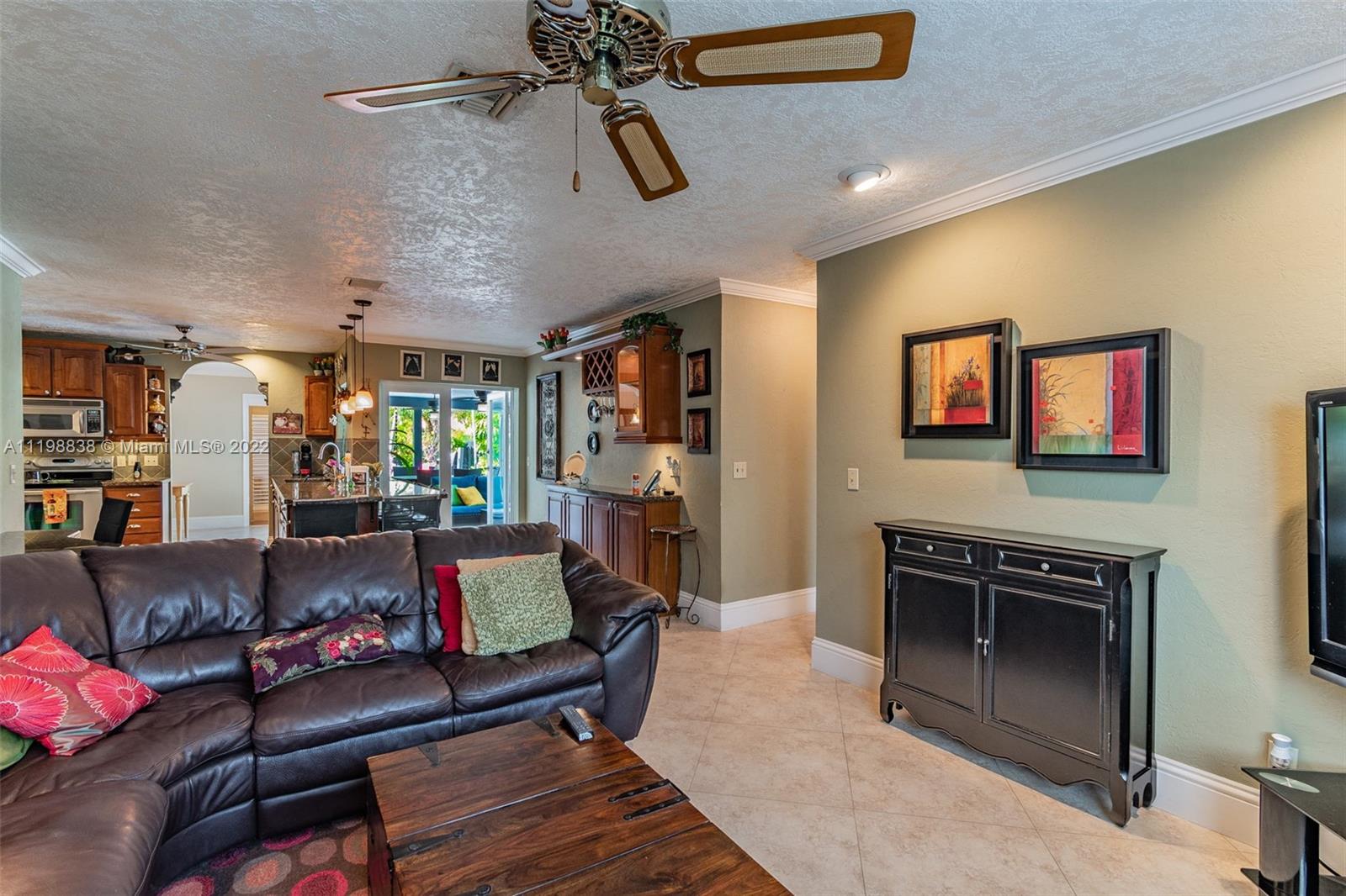 3015 Dunlin Road Delray Beach, FL 33444 - Photo 21 of 47 a living room with furniture and a fireplace