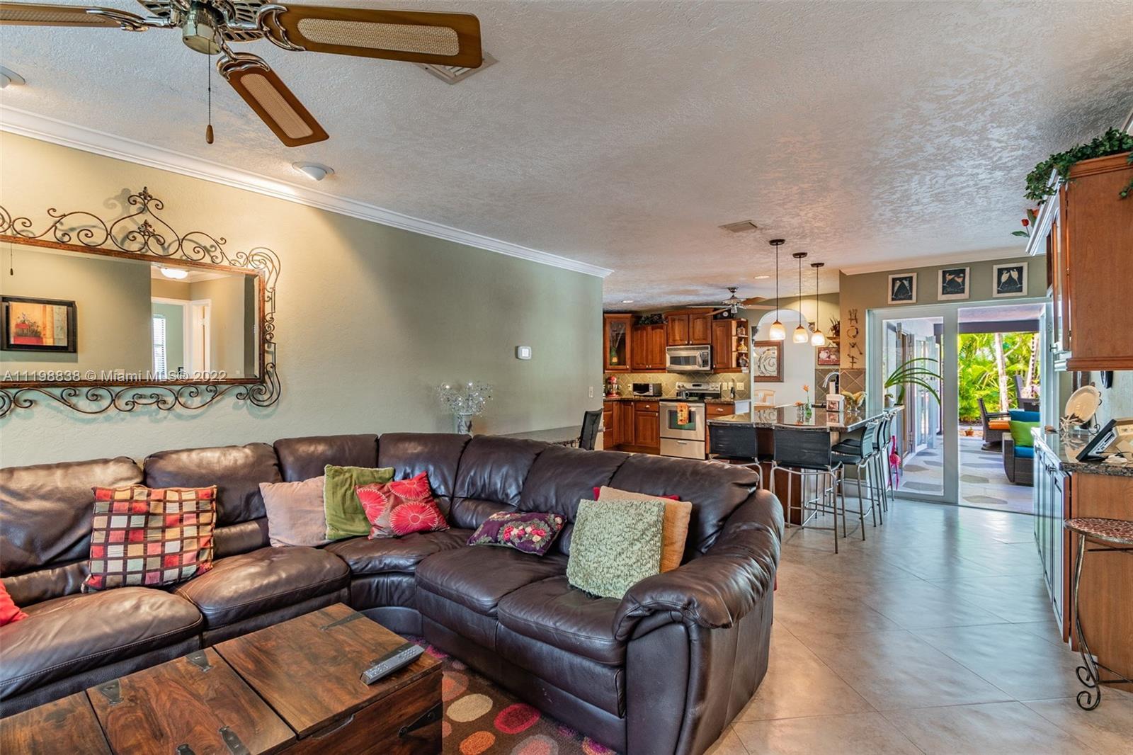 3015 Dunlin Road Delray Beach, FL 33444 - Photo 22 of 47 a living room with furniture and wooden floor