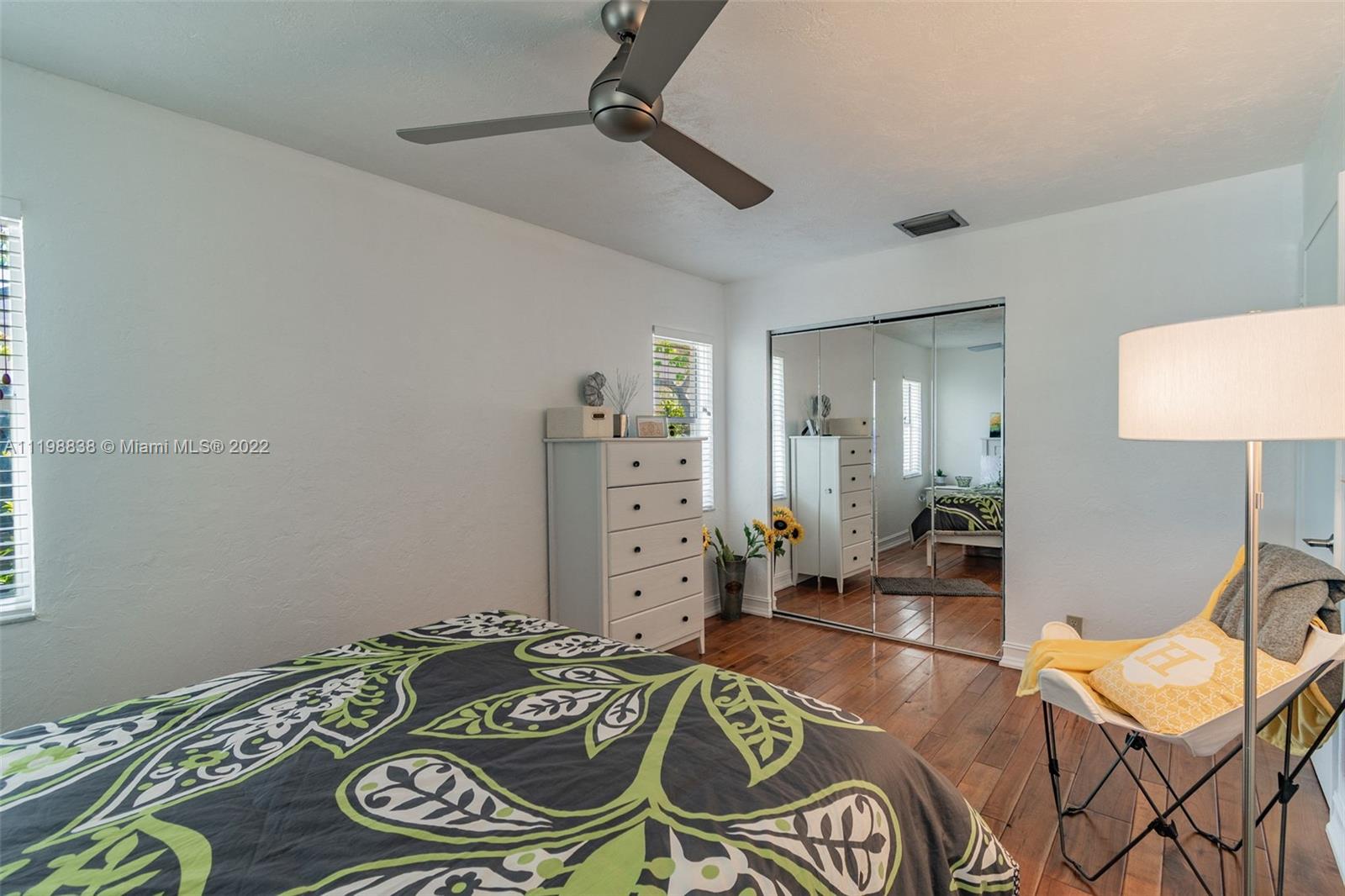 3015 Dunlin Road Delray Beach, FL 33444 - Photo 25 of 47 a bed room with a bed and a chair