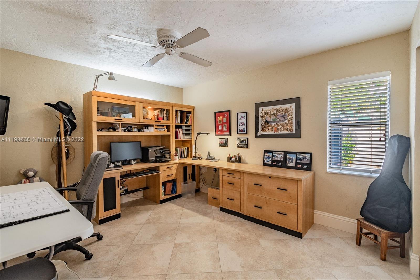 3015 Dunlin Road Delray Beach, FL 33444 - Photo 26 of 47 a view of a workspace with furniture and a window