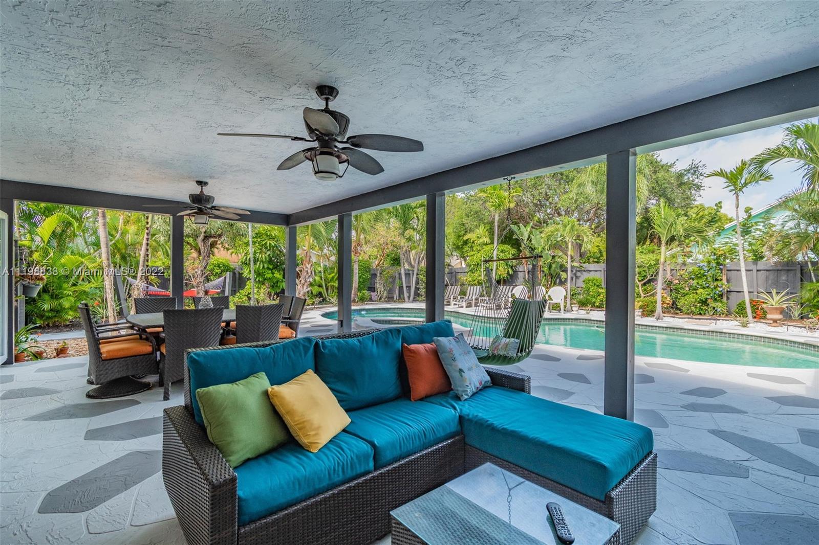 3015 Dunlin Road Delray Beach, FL 33444 - Photo 36 of 47 a living room with furniture and a large window