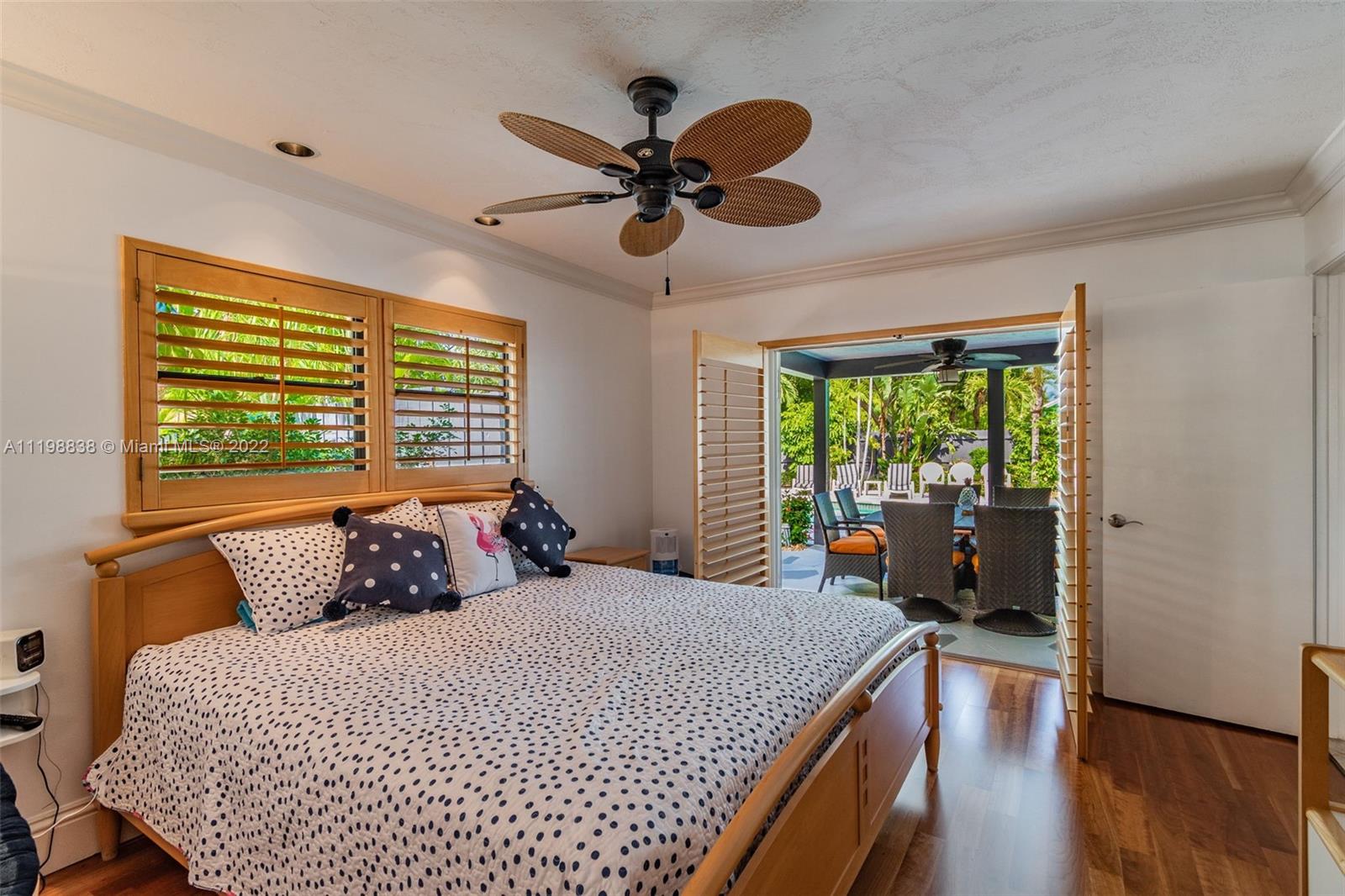 3015 Dunlin Road Delray Beach, FL 33444 - Photo 38 of 47 a bedroom with a large bed and a window