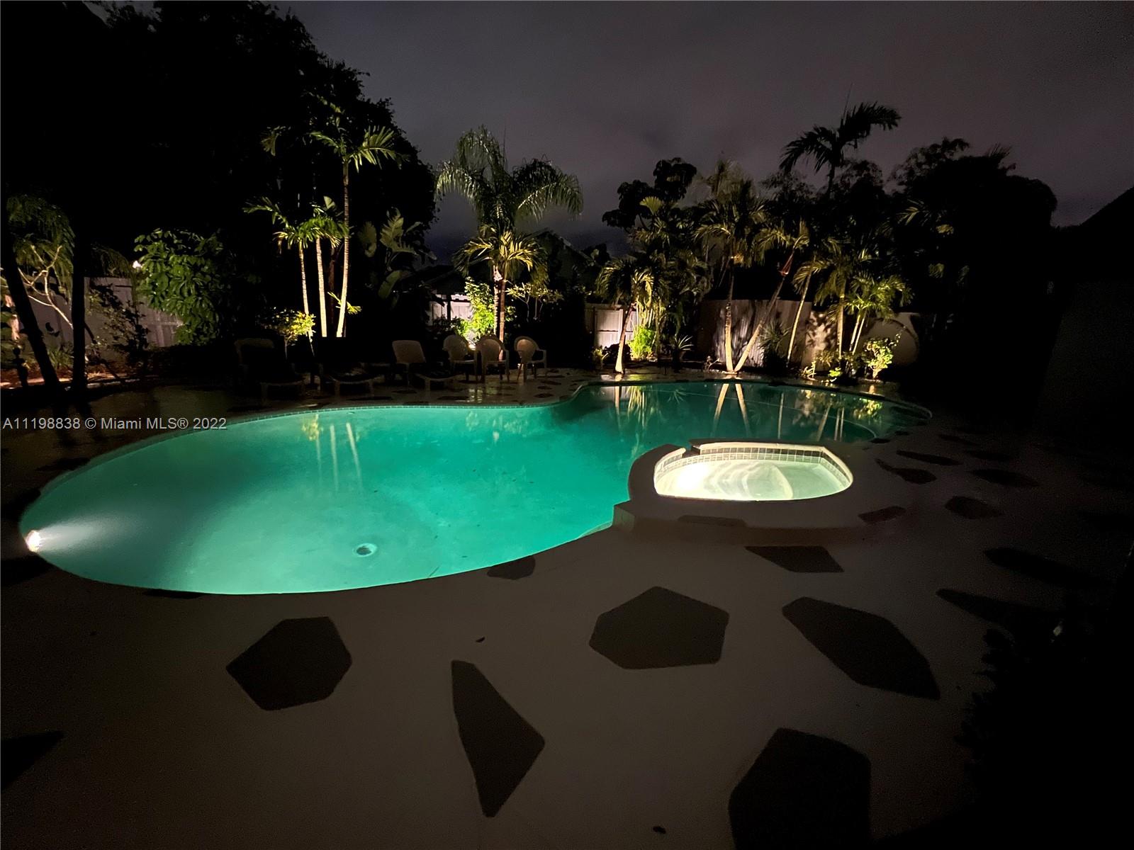 3015 Dunlin Road Delray Beach, FL 33444 - Photo 47 of 47 a view of a swimming pool with outdoor seating