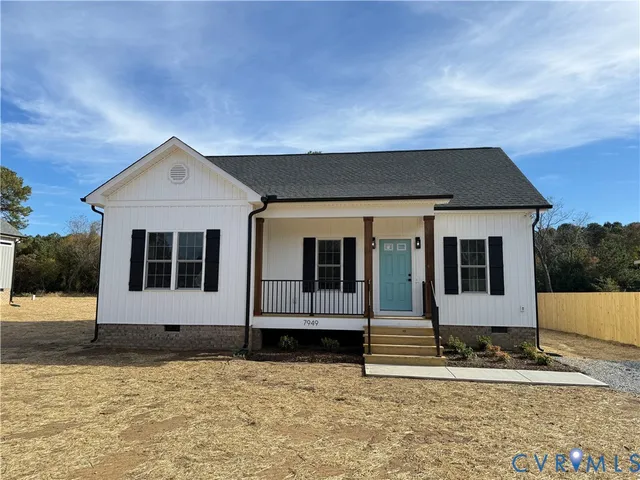 a front view of a house with garage