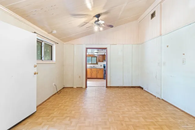 a view of an empty room with a window