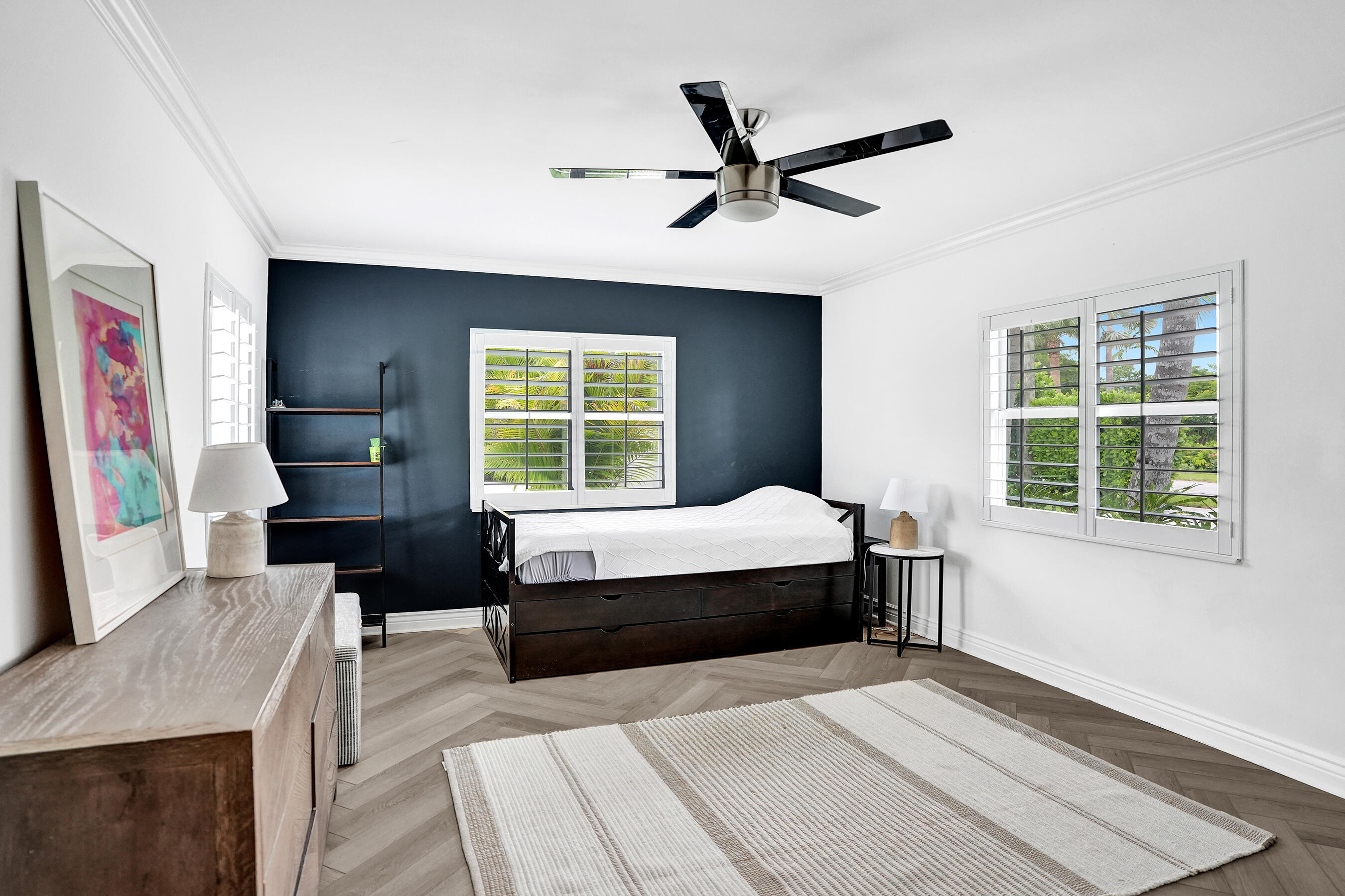 915 North Swinton Avenue Delray Beach, FL 33444 - Photo 16 of 23 a bedroom with a large bed and a window