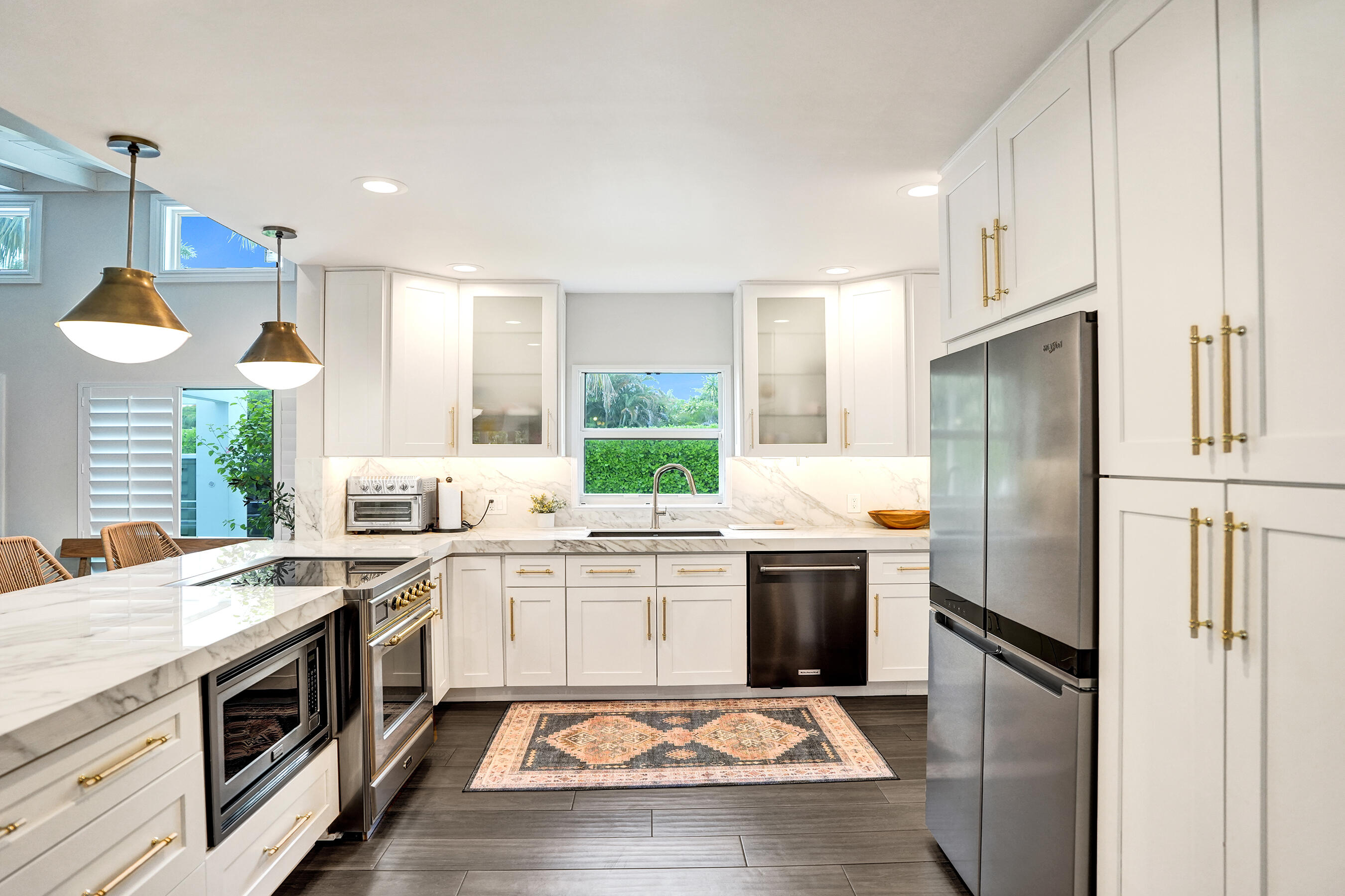 915 North Swinton Avenue Delray Beach, FL 33444 - Photo 7 of 23 a kitchen with a stove a sink and a refrigerator