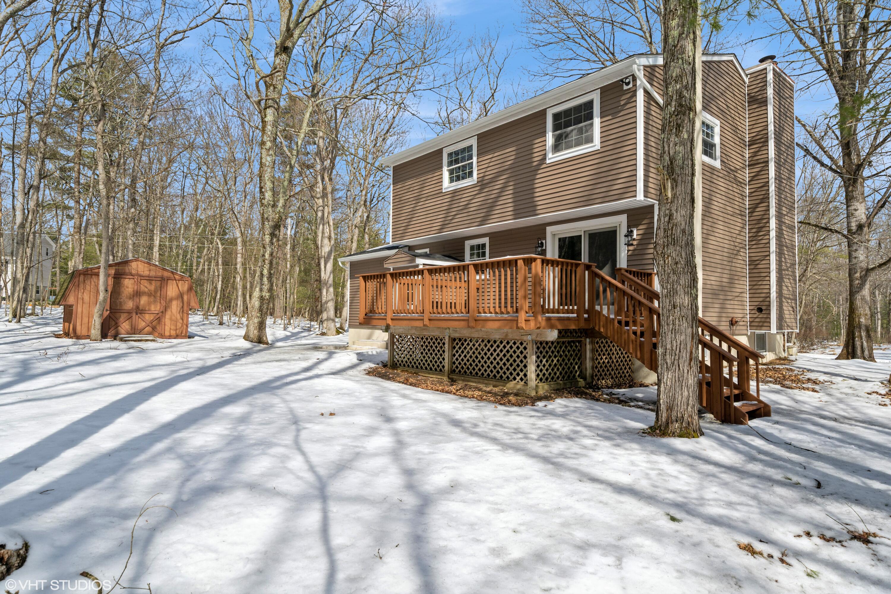 122 Fox Road Dingmans Ferry, PA 18328 - Photo 15 of 15 a view of a house with a yard covered in snow