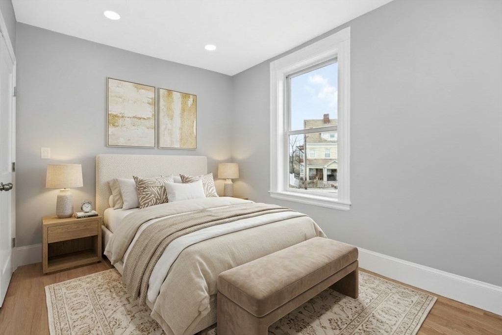66 Stanley Street, Unit 2 Boston, MA 02125 - Photo 4 of 21 a bedroom with a bed and a window