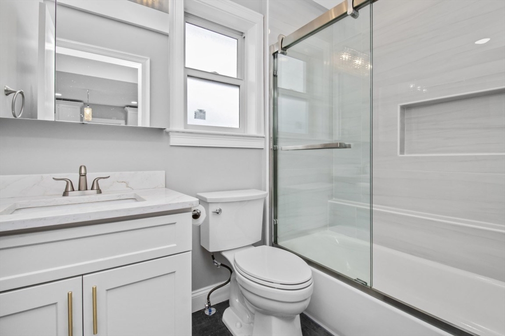 66 Stanley Street, Unit 2 Boston, MA 02125 - Photo 7 of 21 a bathroom with a sink toilet and shower