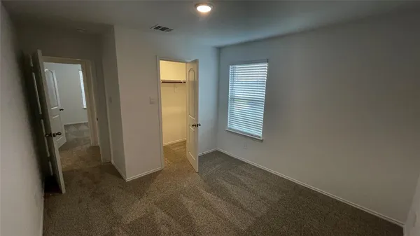 a kitchen with stainless steel appliances wooden floors and wooden cabinets