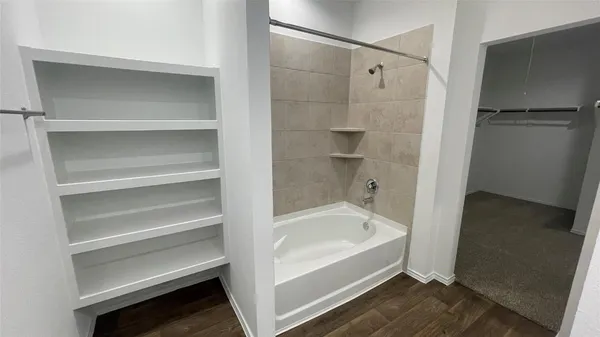 a view of a bathroom from a hallway