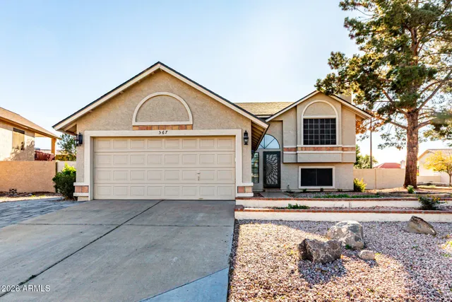 a view of house with yard