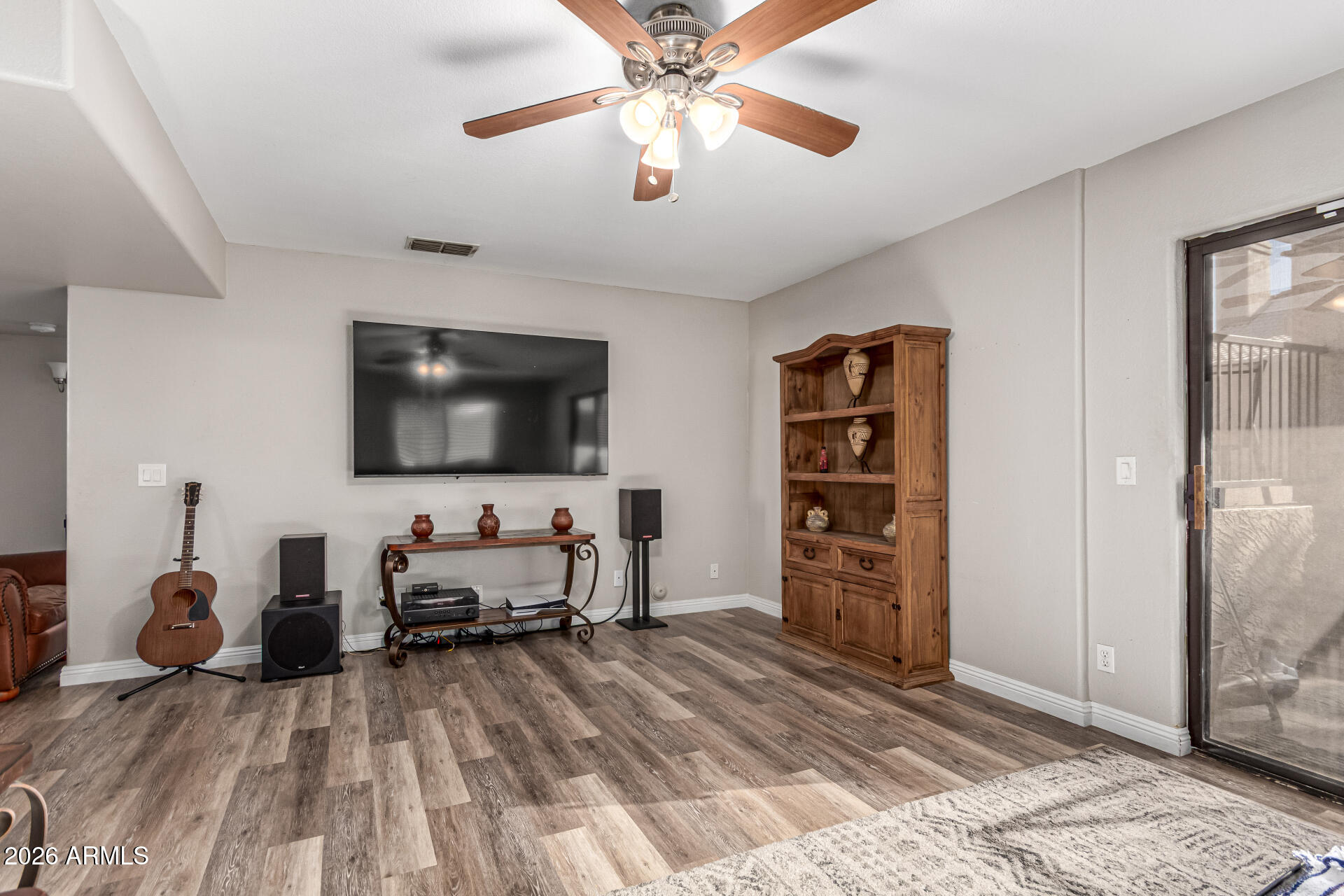 567 West Spur Avenue Gilbert, AZ 85233 - Photo 11 of 42 a living room with furniture and a flat screen tv