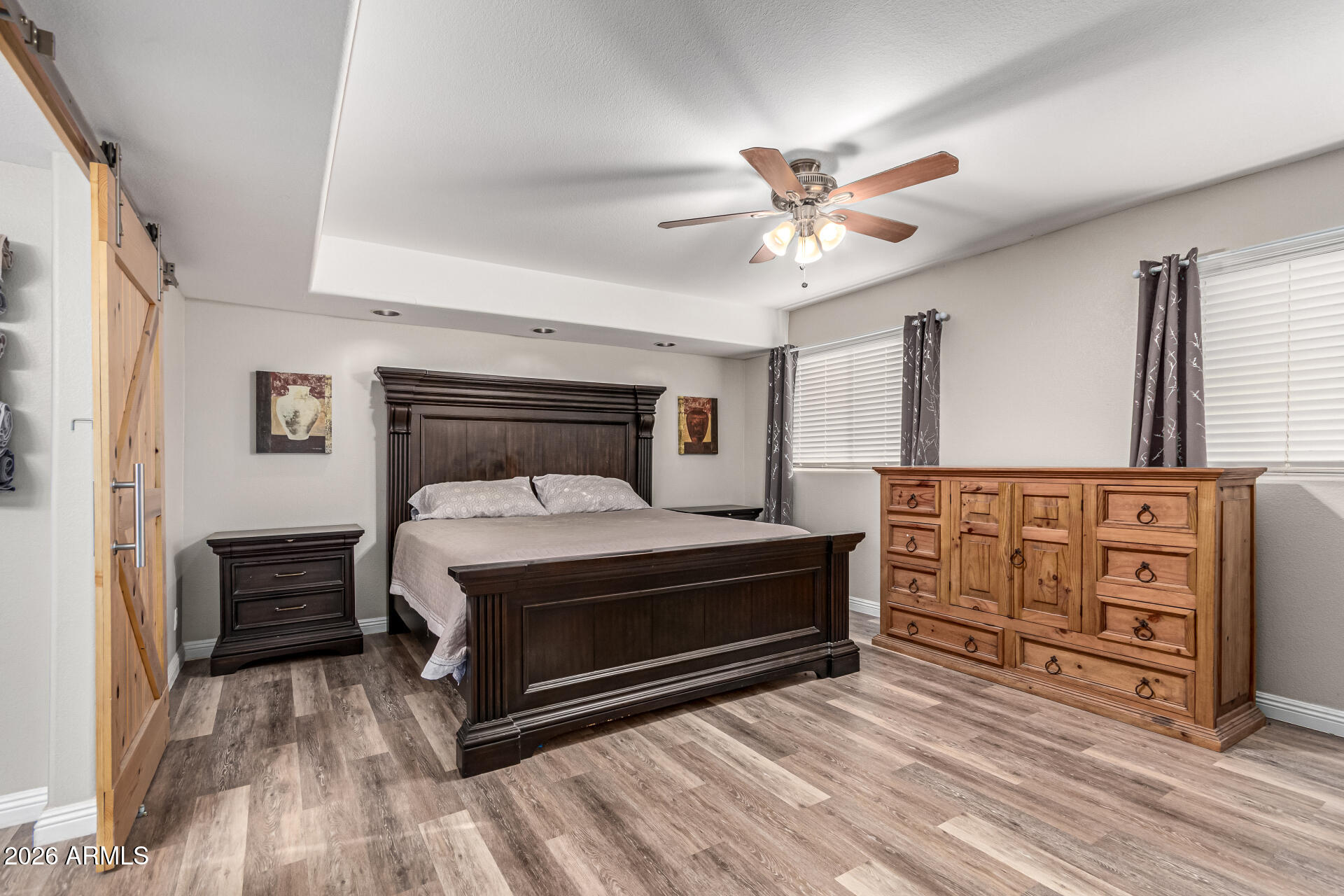 567 West Spur Avenue Gilbert, AZ 85233 - Photo 13 of 42 a bedroom with a bed and a chandelier