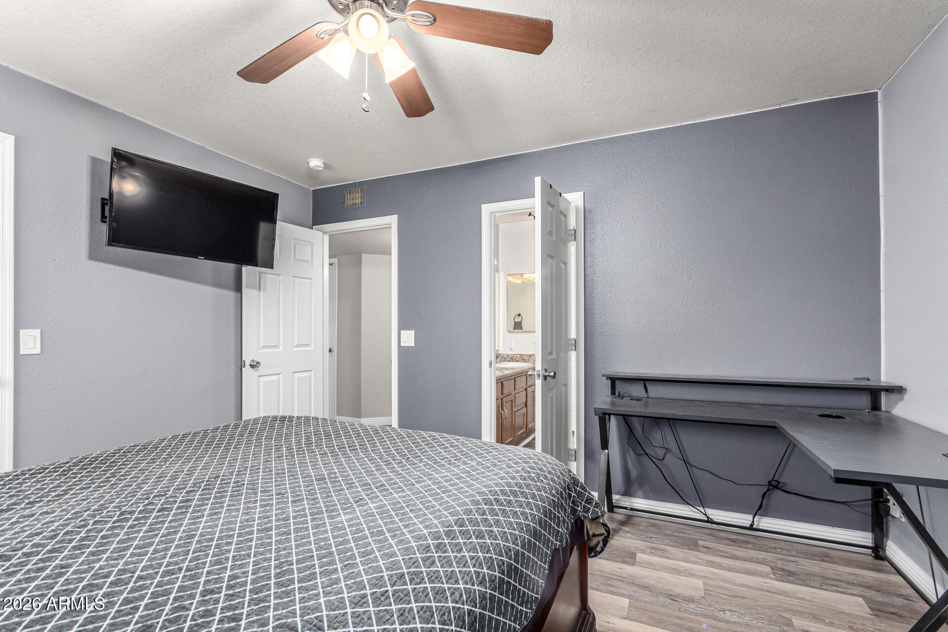 567 West Spur Avenue Gilbert, AZ 85233 - Photo 19 of 42 a bedroom with a bed and a flat screen tv