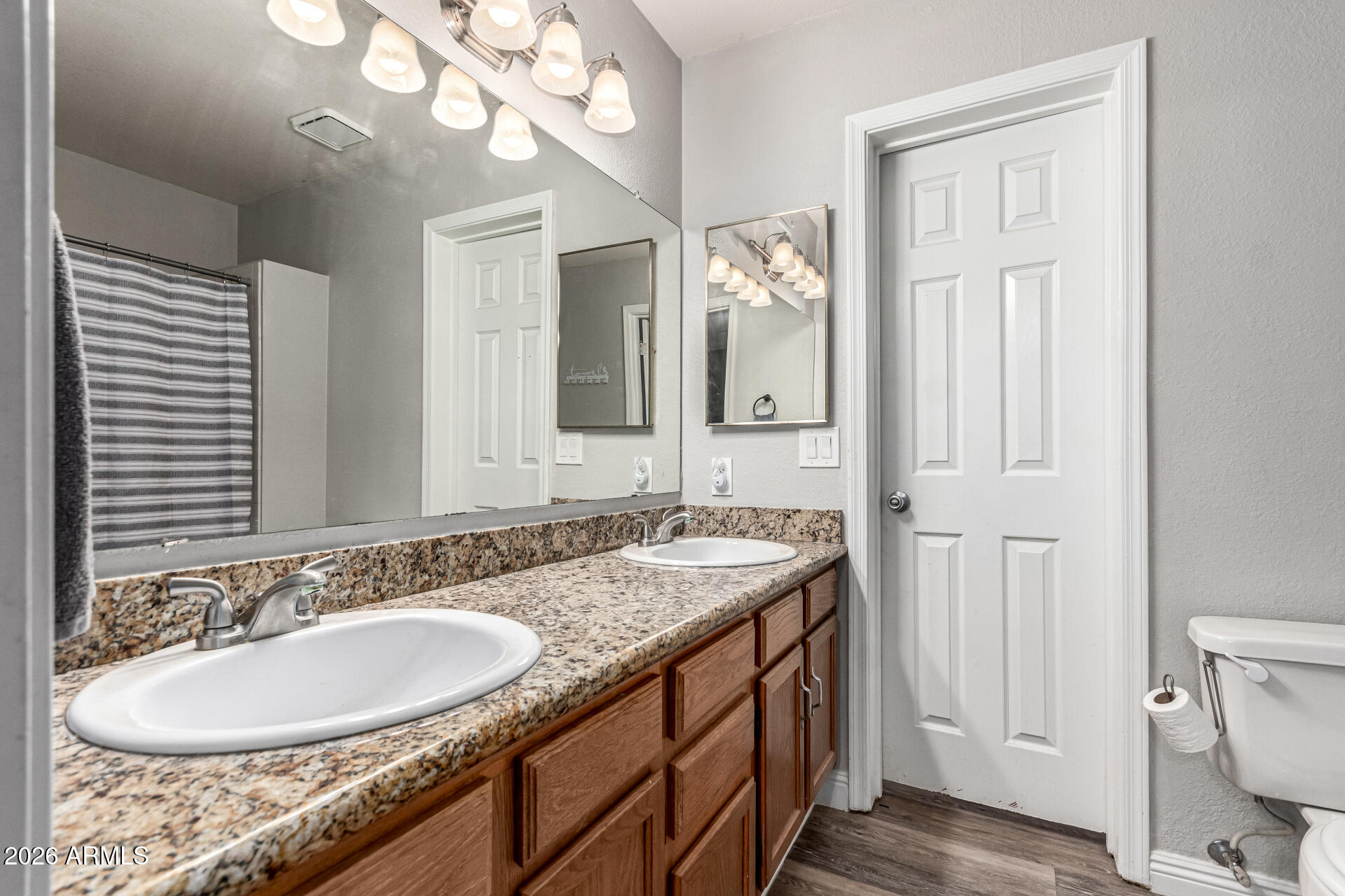 567 West Spur Avenue Gilbert, AZ 85233 - Photo 20 of 42 a bathroom with a granite countertop double vanity sink and a mirror
