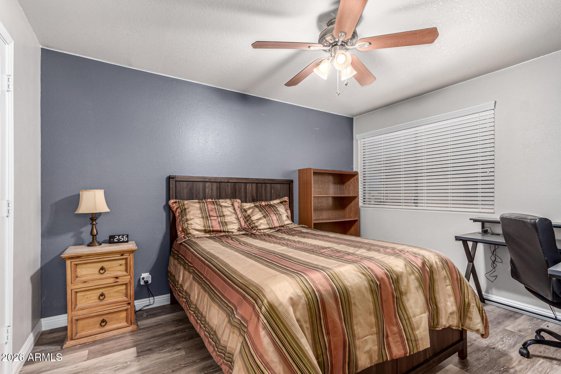 567 West Spur Avenue Gilbert, AZ 85233 - Photo 22 of 42 a bedroom with a bed and a chandelier