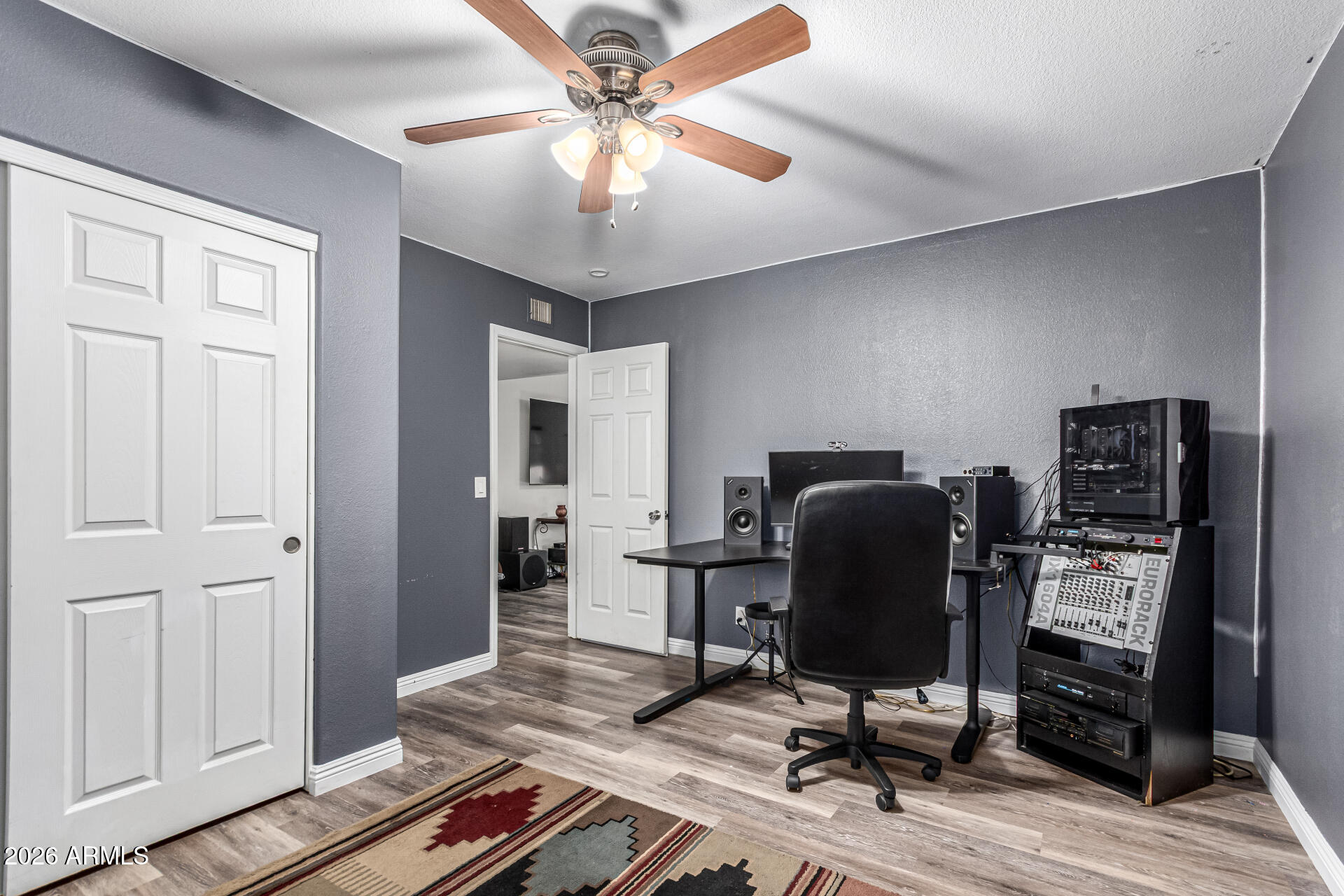 567 West Spur Avenue Gilbert, AZ 85233 - Photo 24 of 42 a view of a workspace with furniture and a window