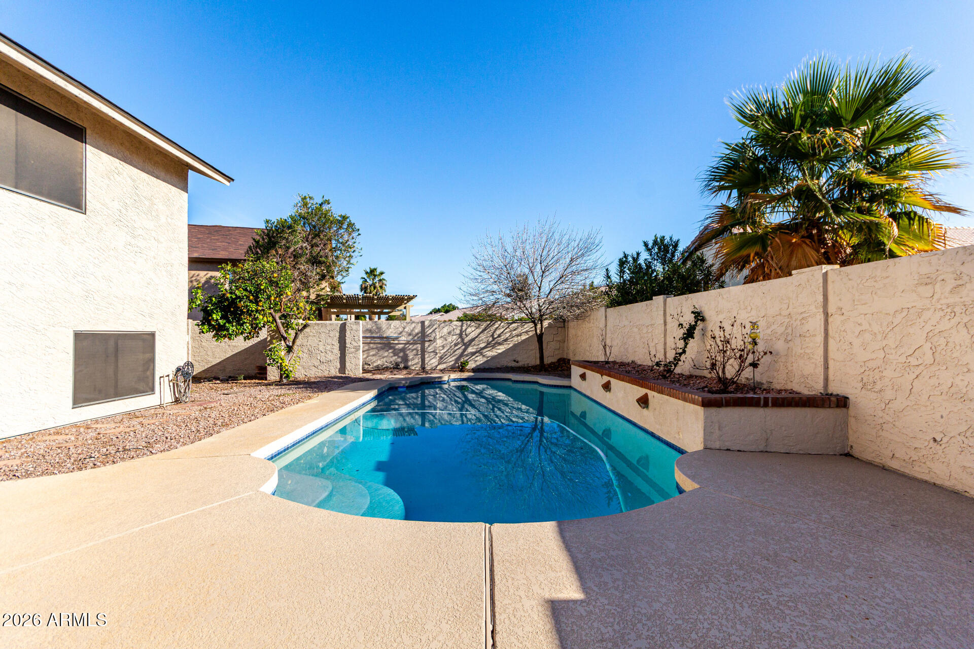 567 West Spur Avenue Gilbert, AZ 85233 - Photo 32 of 42 a view of a swimming pool with an outdoor seating
