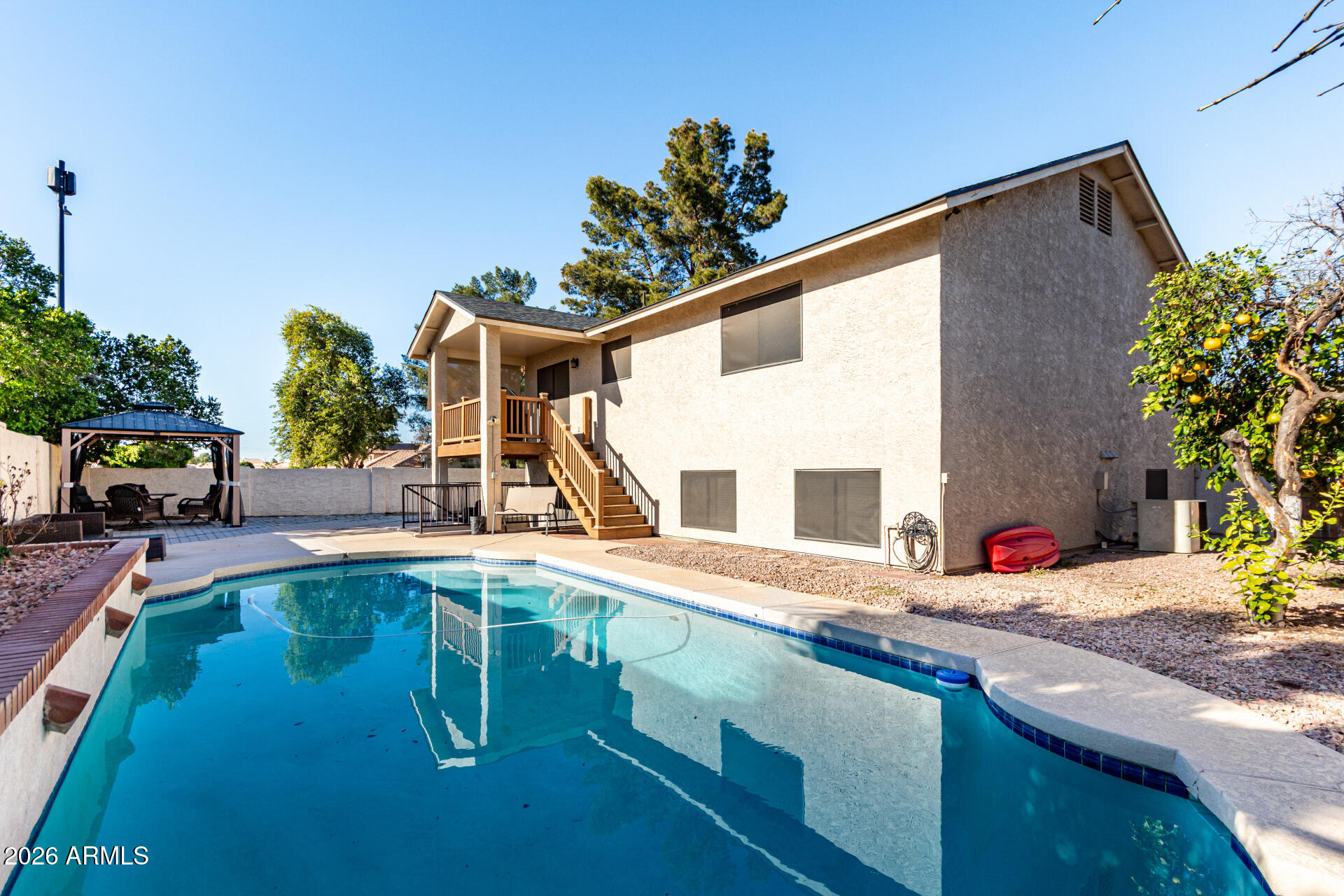 567 West Spur Avenue Gilbert, AZ 85233 - Photo 5 of 42 a view of a backyard with a patio and plants