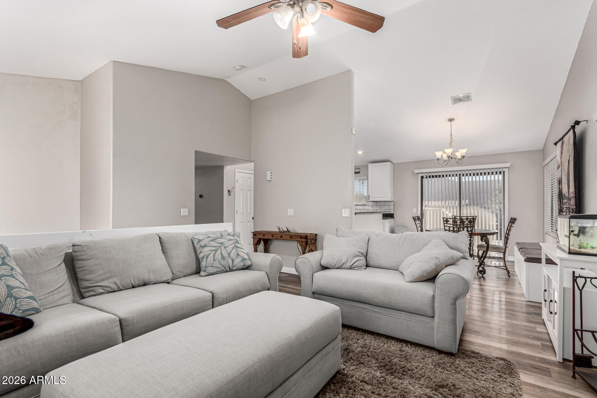 567 West Spur Avenue Gilbert, AZ 85233 - Photo 5 of 42 a living room with furniture and a chandelier