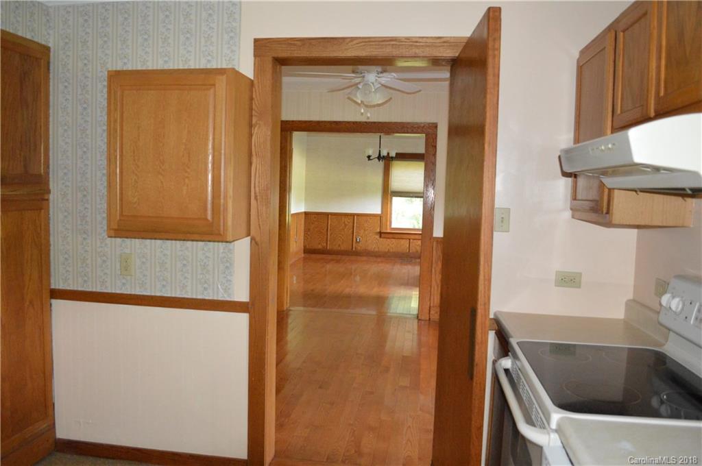 3960 Old Clyde Road Clyde, NC 28721 - Photo 19 of 36 a bathroom with a tub sink and mirror