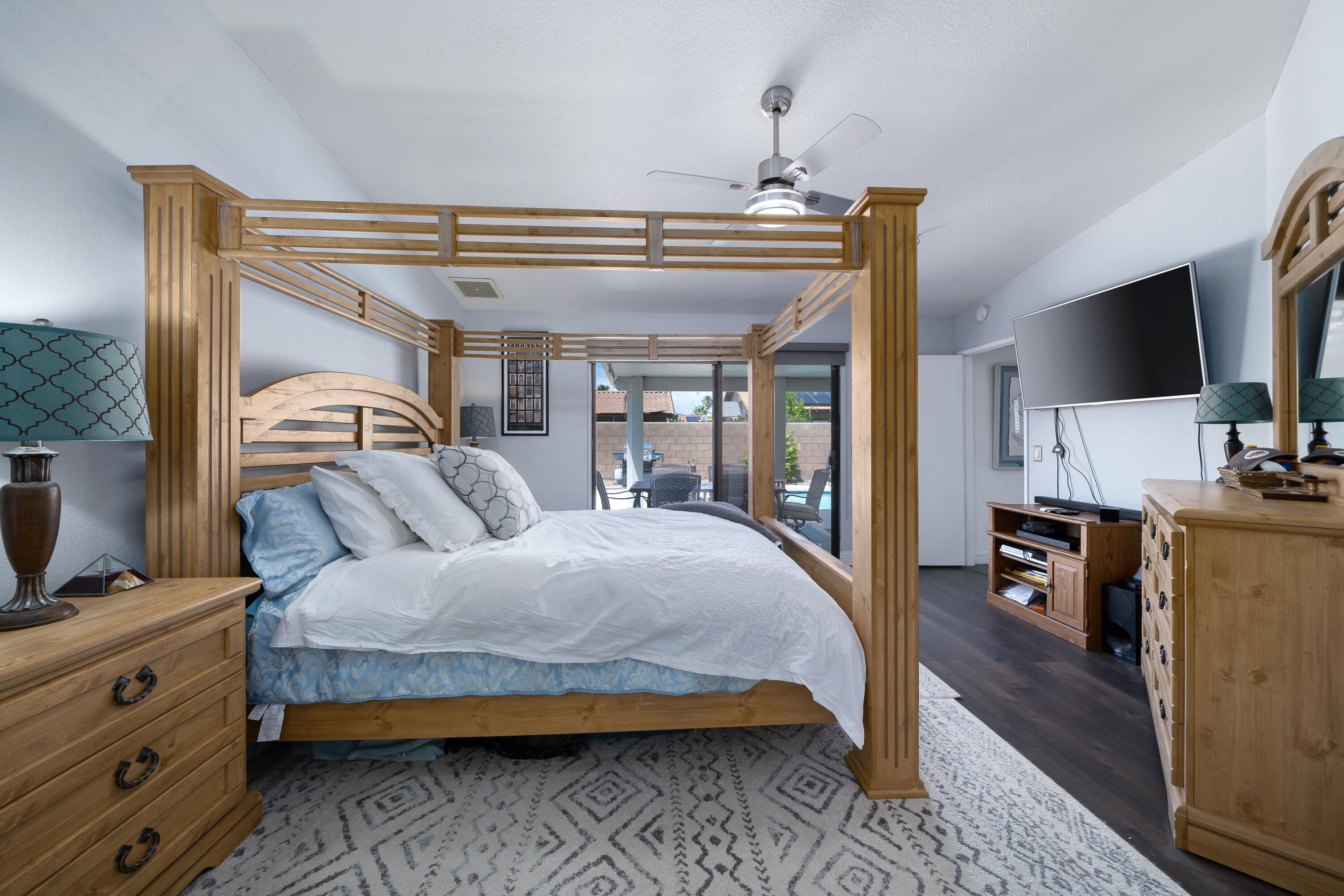 67350 Rango Road Cathedral City, CA 92234 - Photo 14 of 30 a bedroom with a bed and wooden floor
