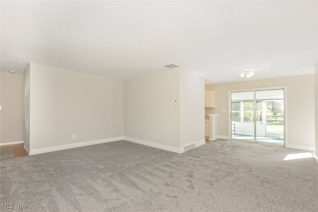 1691 Harwich Road Lyndhurst, OH 44124 - Photo 9 of 45 Living & dining rooms, sliding doors to enclosed porch.