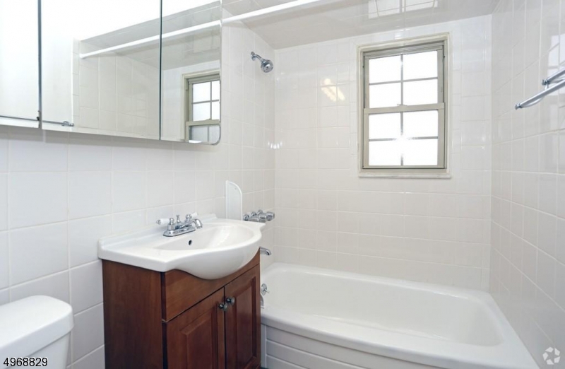 29 Paterson Avenue, Unit 35 Newton, NJ 07860 - Photo 3 of 4 a bathroom with a sink mirror toilet and bathtub
