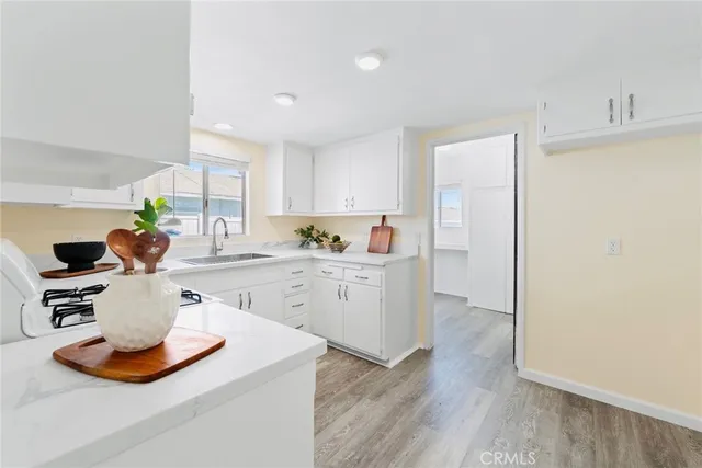 a kitchen with a sink and cabinets