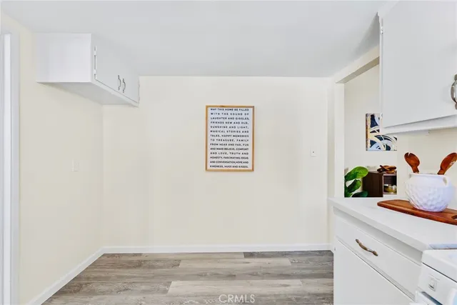 a view of room with hardwood floor