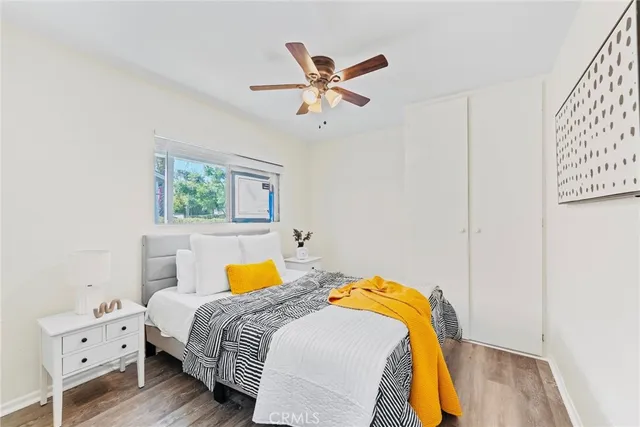 a bedroom with a bed and window