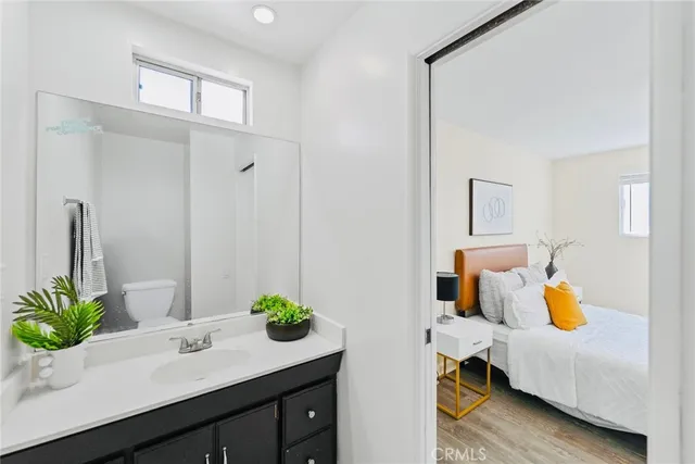 a view of bathroom with a sink and mirror
