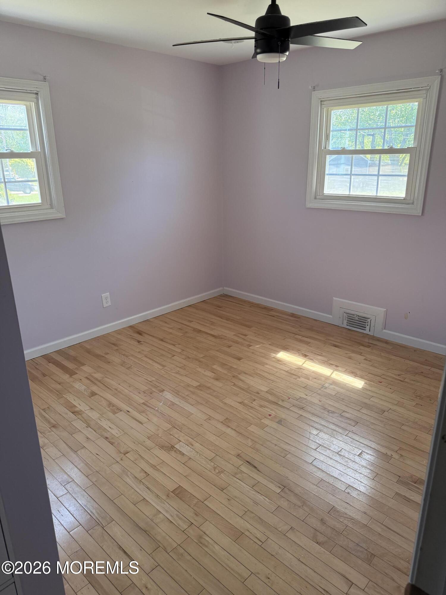 3 Lake Drive Howell, NJ 07731 - Photo 12 of 18 wooden floor in an empty room with a window