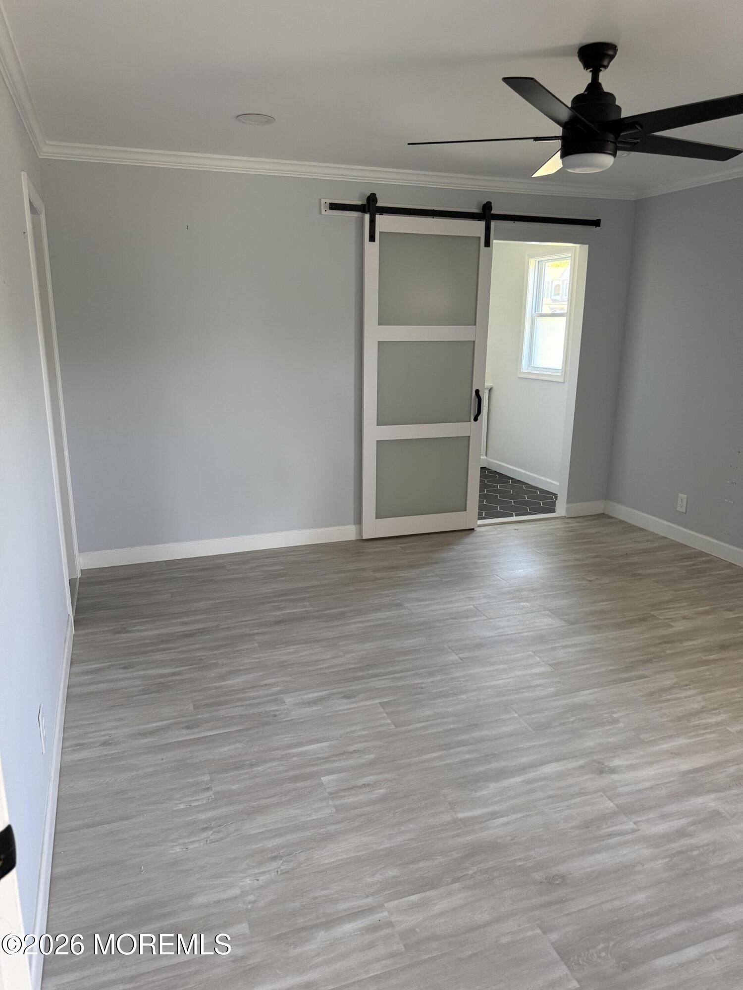 3 Lake Drive Howell, NJ 07731 - Photo 14 of 18 a view of an empty room with wooden floor and a window