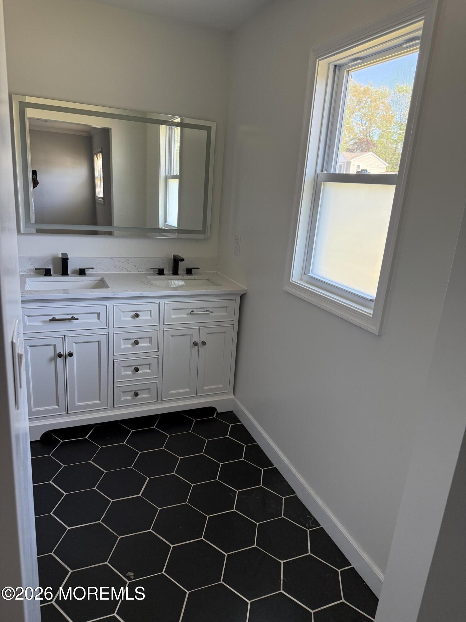 3 Lake Drive Howell, NJ 07731 - Photo 17 of 18 a bathroom with a sink and a mirror