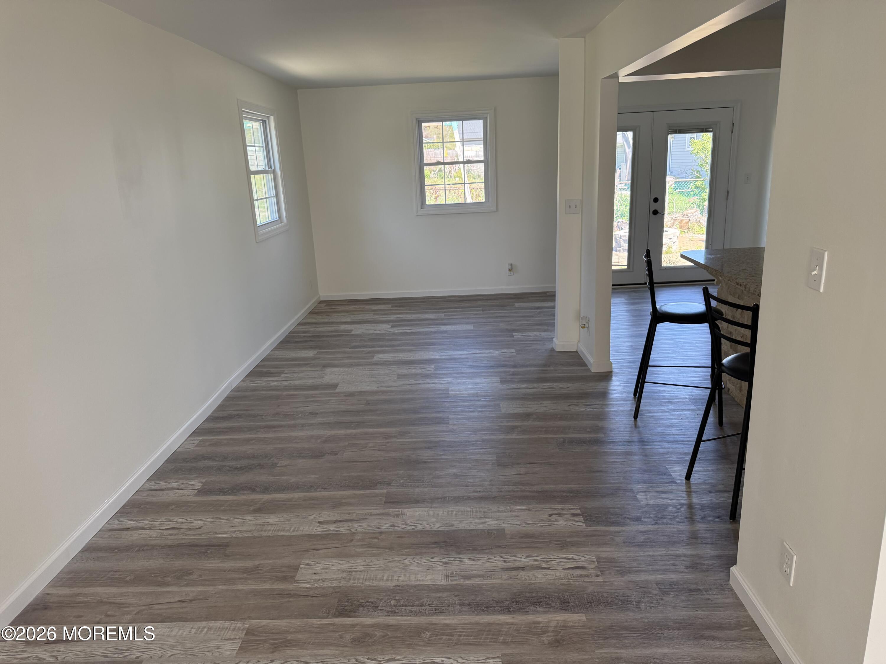 3 Lake Drive Howell, NJ 07731 - Photo 6 of 18 a view of a hallway view with wooden floor and staircase