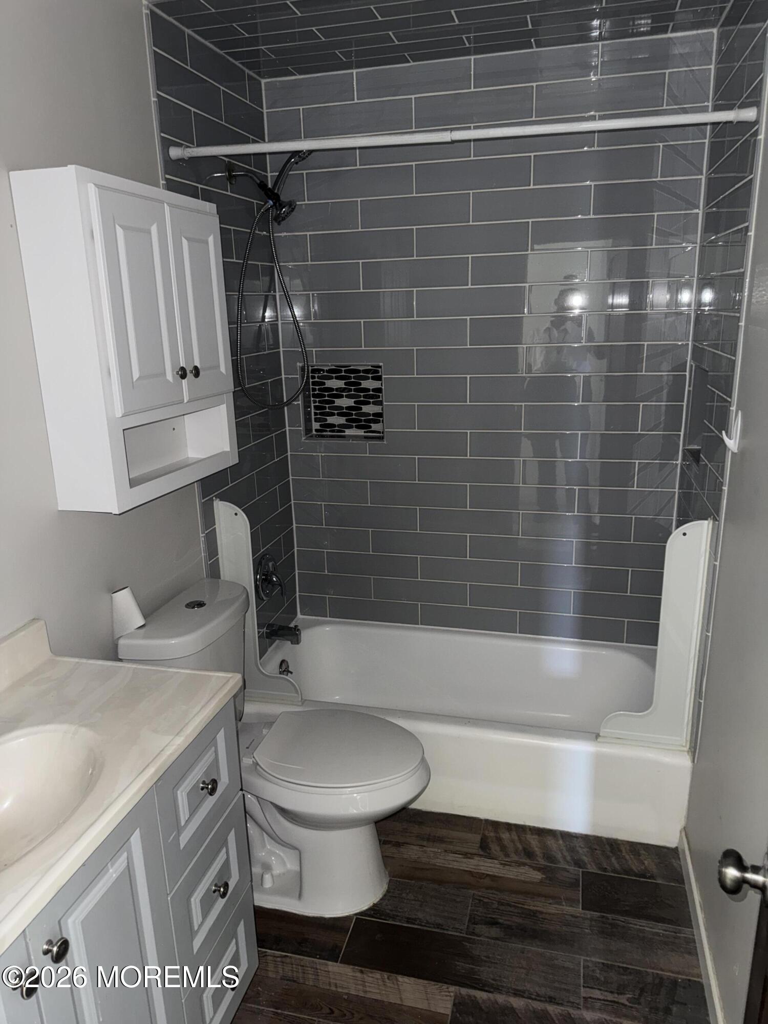3 Lake Drive Howell, NJ 07731 - Photo 9 of 18 a bathroom with a sink a toilet and shower