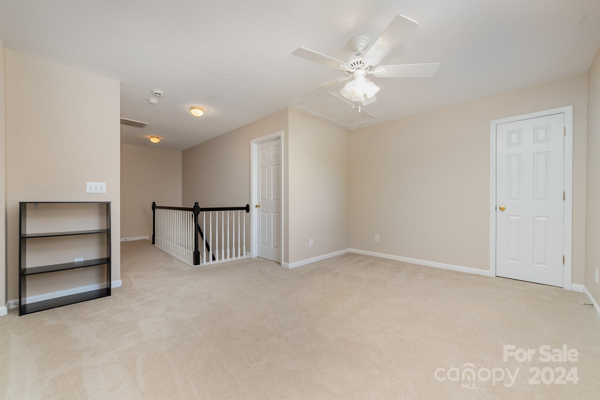 11546 Rabbit Ridge Road Charlotte, NC 28270 - Photo 12 of 17 an empty room with a ceiling fan and window
