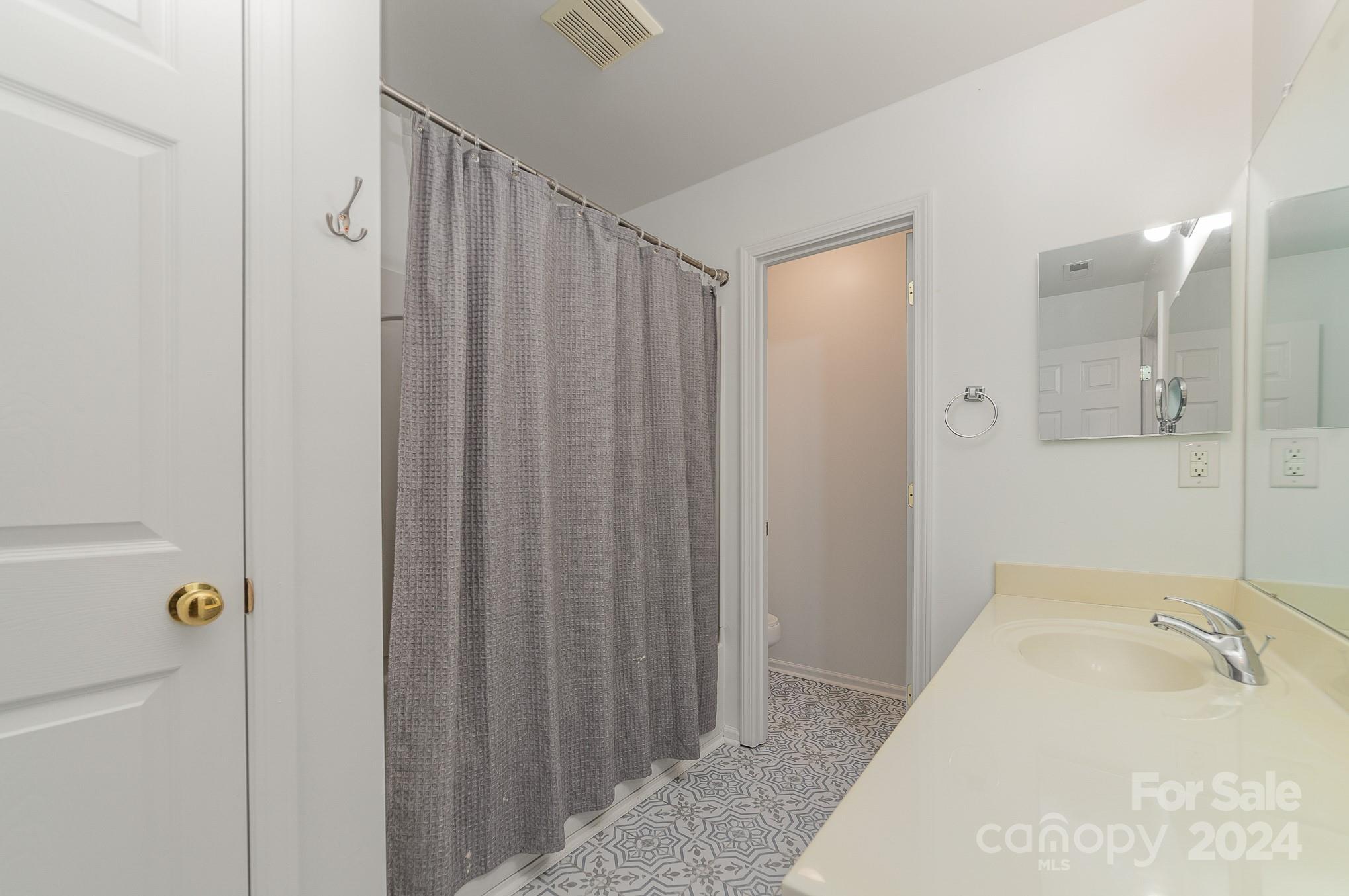 11546 Rabbit Ridge Road Charlotte, NC 28270 - Photo 15 of 17 a bathroom with a tub sink and shower