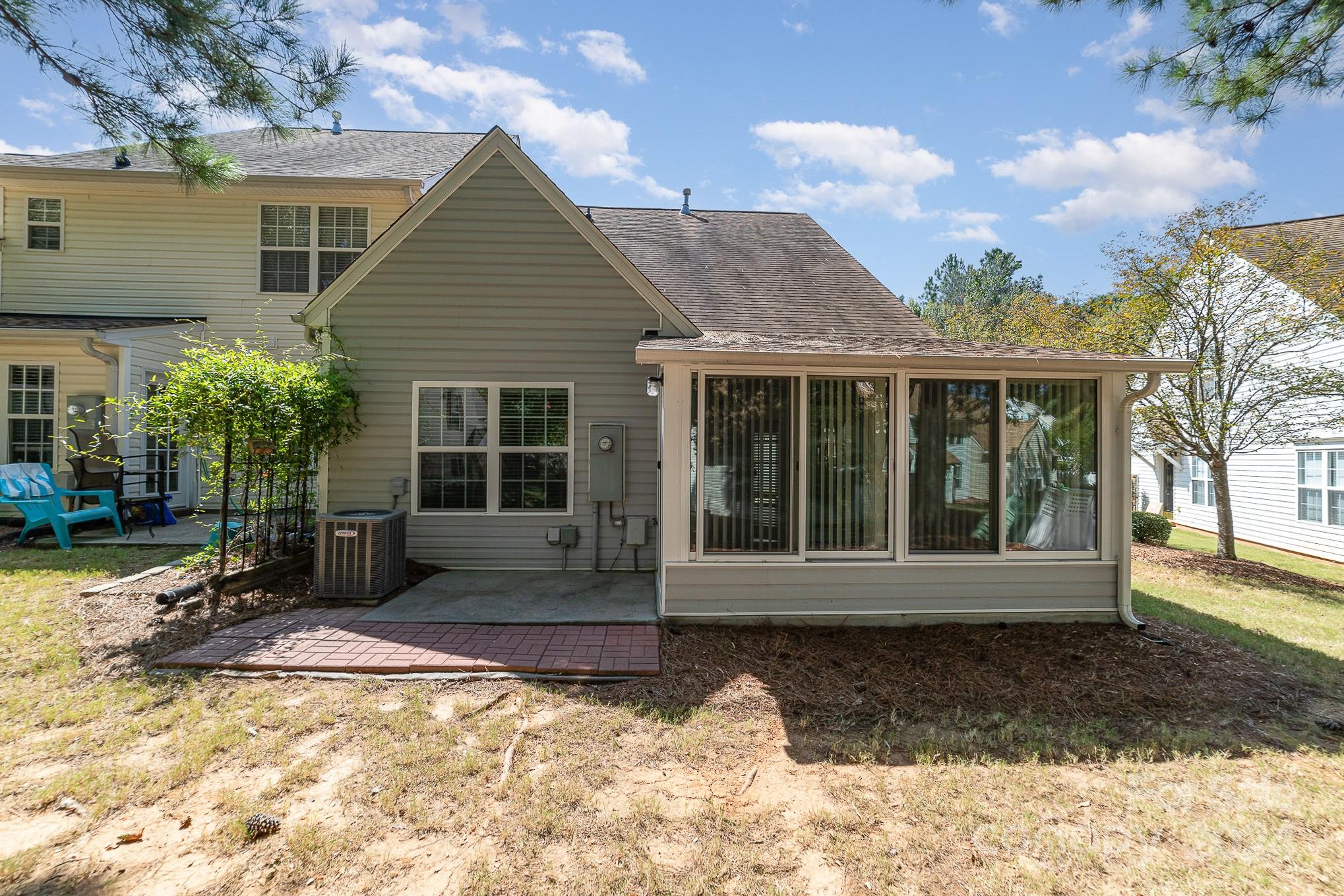 11546 Rabbit Ridge Road Charlotte, NC 28270 - Photo 17 of 17 a view of a house with backyard outdoor seating and covered with trees