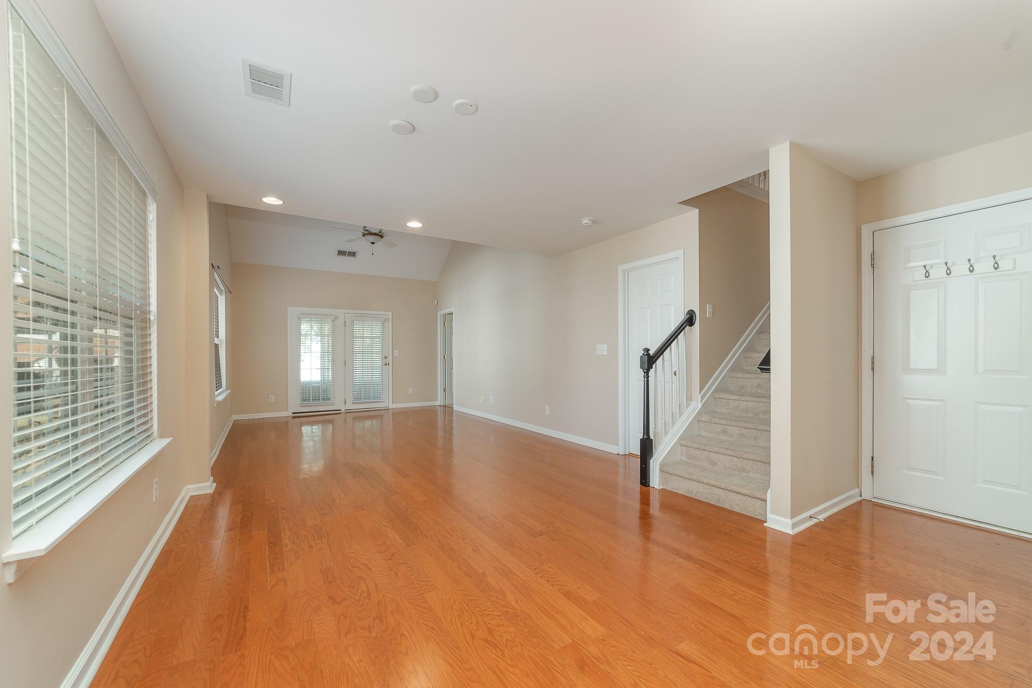 11546 Rabbit Ridge Road Charlotte, NC 28270 - Photo 4 of 17 a view of empty room with wooden floor and fan