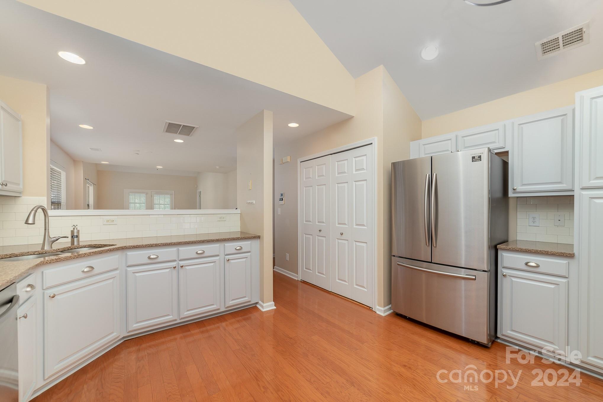 11546 Rabbit Ridge Road Charlotte, NC 28270 - Photo 5 of 17 a kitchen with stainless steel appliances granite countertop a refrigerator and a sink