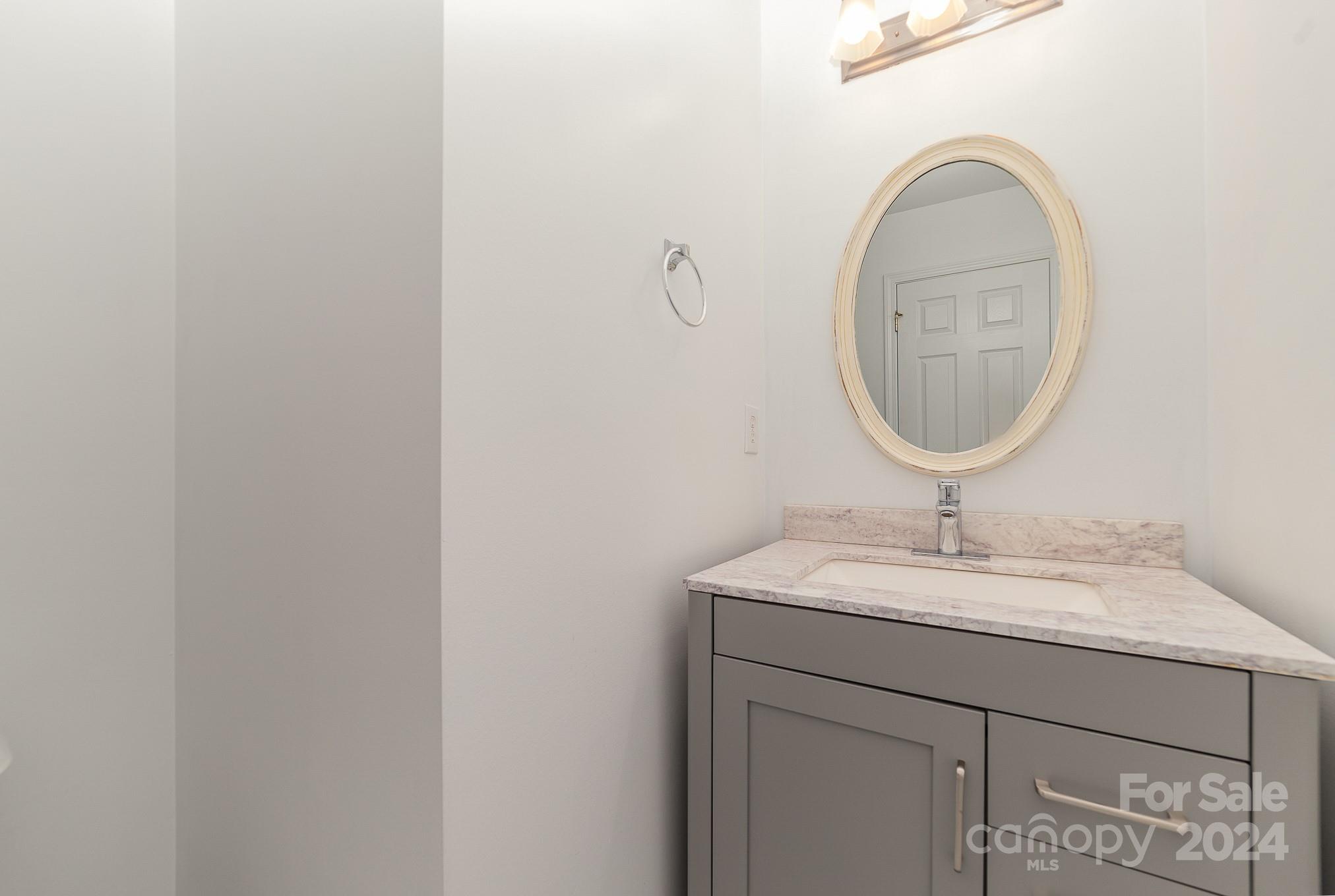 11546 Rabbit Ridge Road Charlotte, NC 28270 - Photo 9 of 17 a bathroom with a sink and a mirror