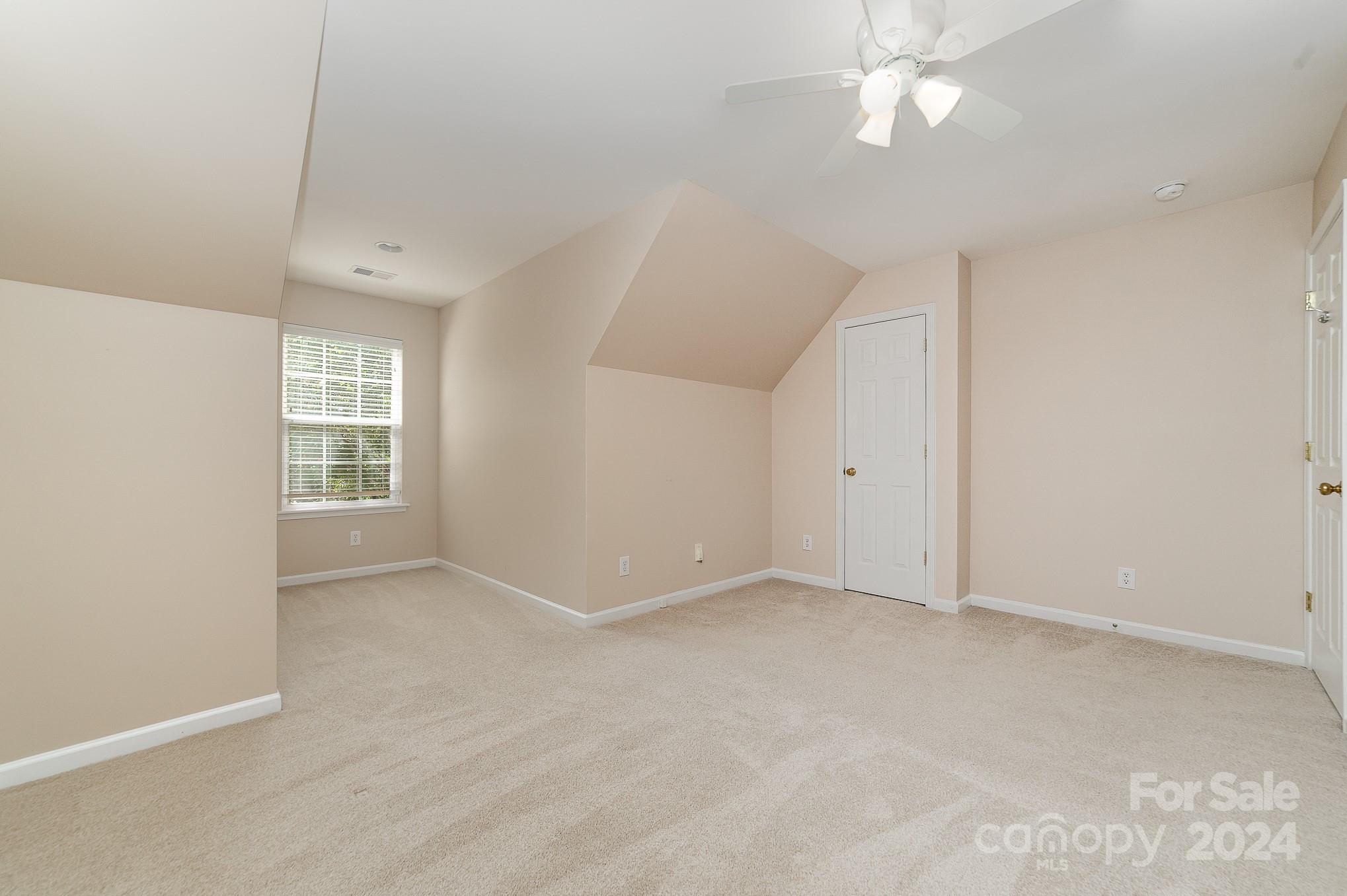 11546 Rabbit Ridge Road Charlotte, NC 28270 - Photo 10 of 17 a view of an empty room with a window